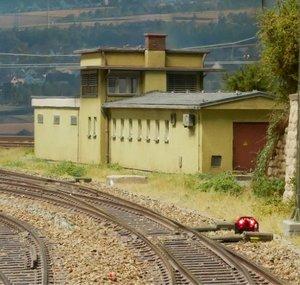 Model trains in a especially dreary layout