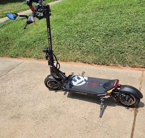 HAPPY JACK ELECTRIC SCOOTER RIDER